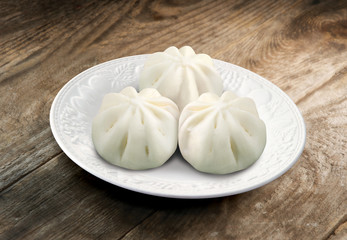 Chinese steamed buns on a plate