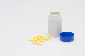 Chlorpheniramine Tablets and Bottle on the white table