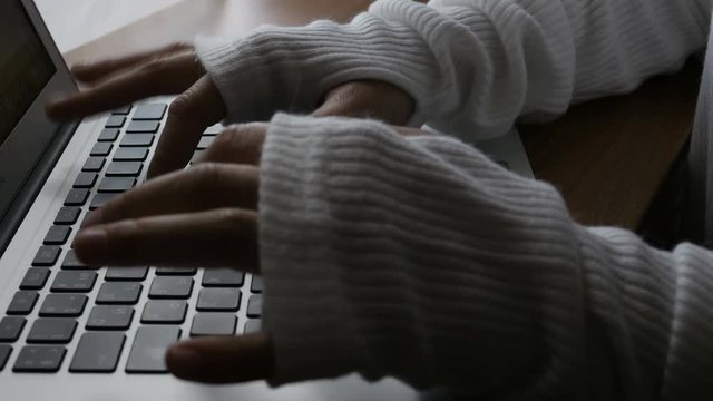 Unrecognizable woman typing laptop