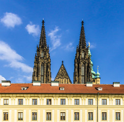 Fototapeta na wymiar View to the St. Vitus church from the side first courtyard of Prague Castle . Area of the Old Town. Prague, Czech Republic.