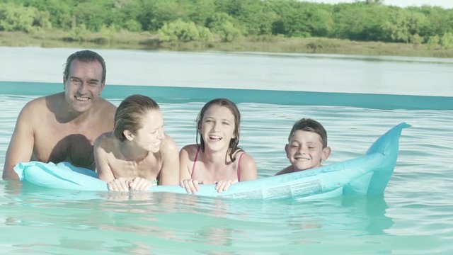 Family together on float in water