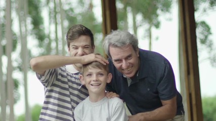Boy with father and grandfather, portrait