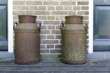 Naklejka premium two old rusted churns