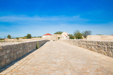     Dalmatian landscape, stone bridge in town of Nin, Dalmatia, Croatia 
