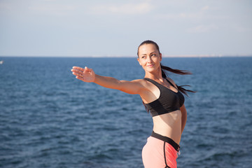 pretty girl plays sports fitness on the beach