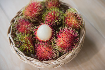 fresh rambutan sweet delicious in the basket . tropical fruit .