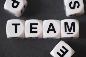 word team on toy cubes