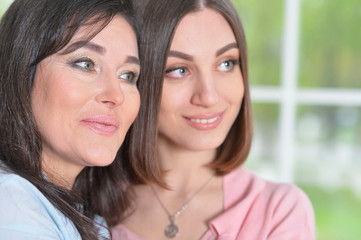 Mother and daughter at the window