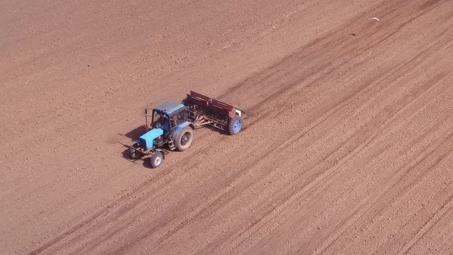 Aerial view of tractor on Prepare a field for planting