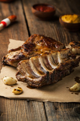Grilled pork ribs with ketchup, mustard and garlic