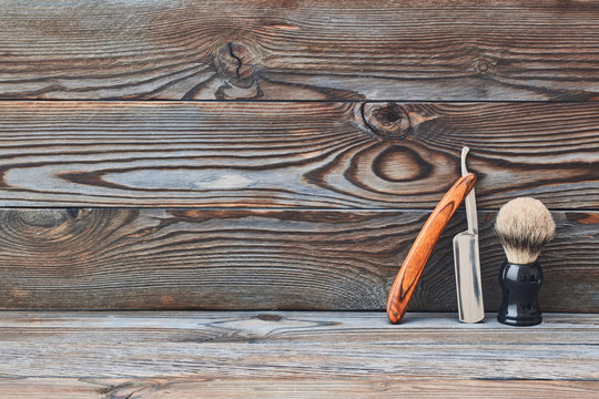 Vintage barber shop tools on wooden background