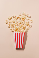 Popcorn in red and white cardboard. Top view