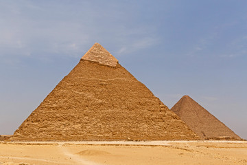 Fototapeta na wymiar pyramids of Khafre and Khufu against blue sky