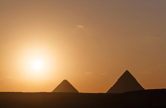 landscape with two pyramids at sunrise