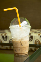 a half cup of cold mocha coffee in the coffee cafe or resturant.