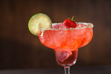 Close-up shot of  Strawberry.Margarita cocktails with salt and lime slices.