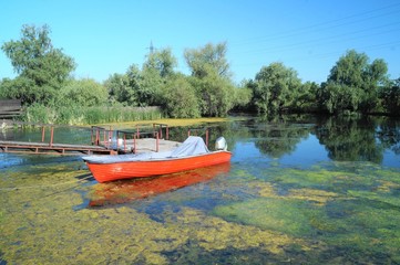 Fototapeta na wymiar Landscape from the Danube delta with boat, Romania (Delta Dunarii) 