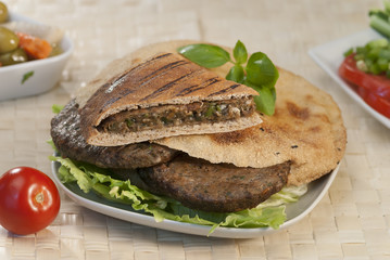 Egyptian Hawawshi  with pita bread and salad