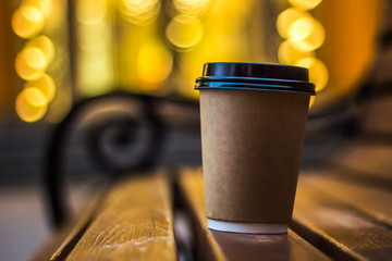 the cup of coffee on the bench