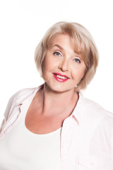 Beautiful elderly woman smiling over a white background