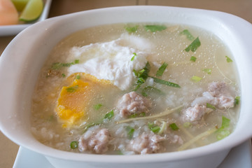 Food : Rice soup with pork and egg in asian style. 