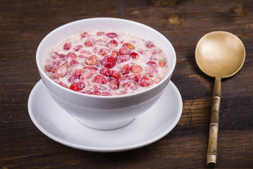 Fresh strawberry milk in a plate