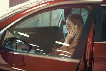 Girl with phone in car