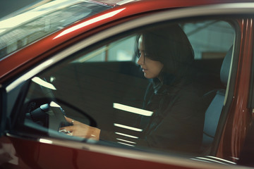 girl admires the car