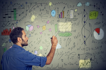 Smart man analyzing human needs writing self development and business plan