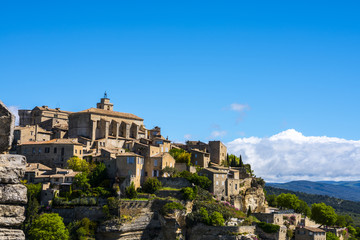 Fototapeta premium View on Gordes, a small typical town in Provence, France. Beautiful village, with view on roof and landscape