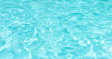 Abstract water wave, sun reflections in pool water