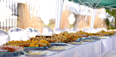 variety catering food on a table, food decoration, party concept, delicatessen,outdoor