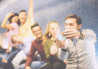 Happy friends taking a photo selfie 