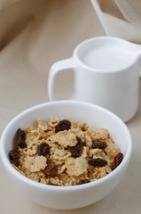 Cereal and Raisin with Milk for Breakfast Meal.
