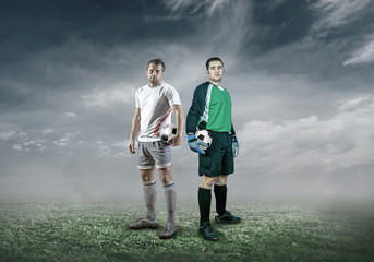 Football player with ball in action under sky with clouds