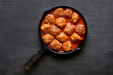 Meatballs with tomato sauce in frying pan
