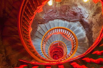 Spiral stone stairs with red painted balustrade - 158278154