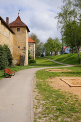 Fototapeta na wymiar Weißenburg city. Bavaria. Germany. Old city. Ancient fortress wall and footpath, playground