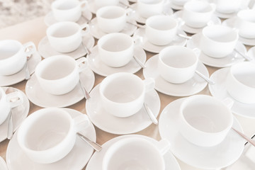 Group of empty coffee cups of white cup for service tea or coffee in breakfast or buffet and seminar event of catering and cocktail.