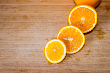 Sliced orange on a wooden board
