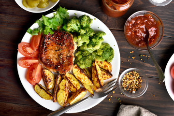 Cooked meat with vegetables on plate