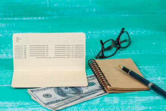 book bank with laptop on wood