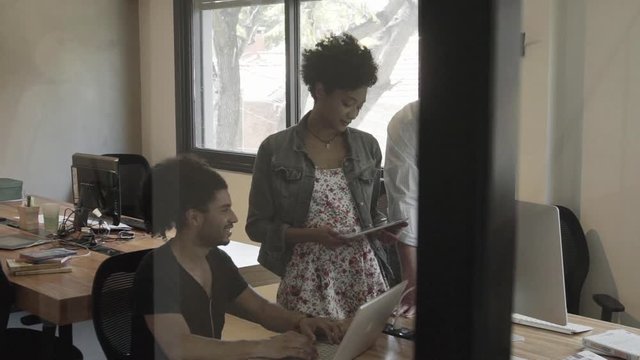 Colleagues collaborating in office