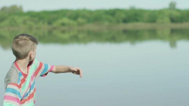 Boy throwing stones