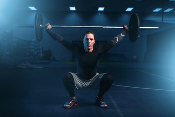 Strength athlete on training, workout with barbell