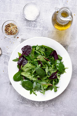 Green salad with leaves of spinach, arugul