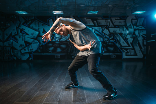 Breakdance performer posing in dance studio