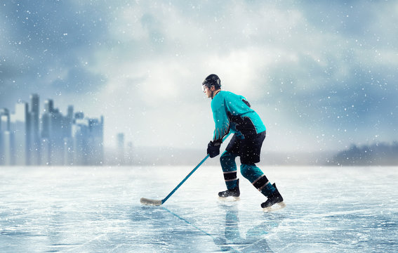 Ice hockey player in action on frozen lake