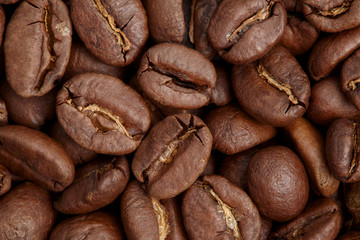 Group of brown coffee grains background, macro, close-up