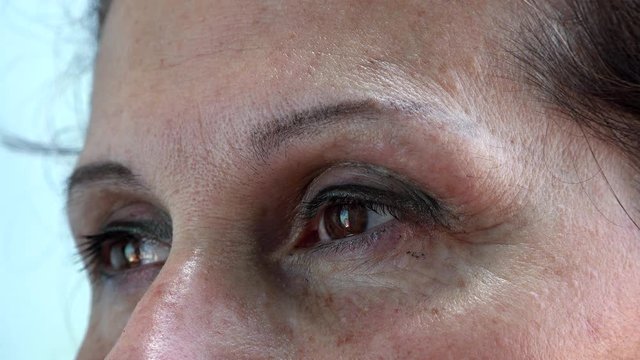 crow feet of eyes of mature Caucasian woman with Arabic and Middle Eastern somatic traits